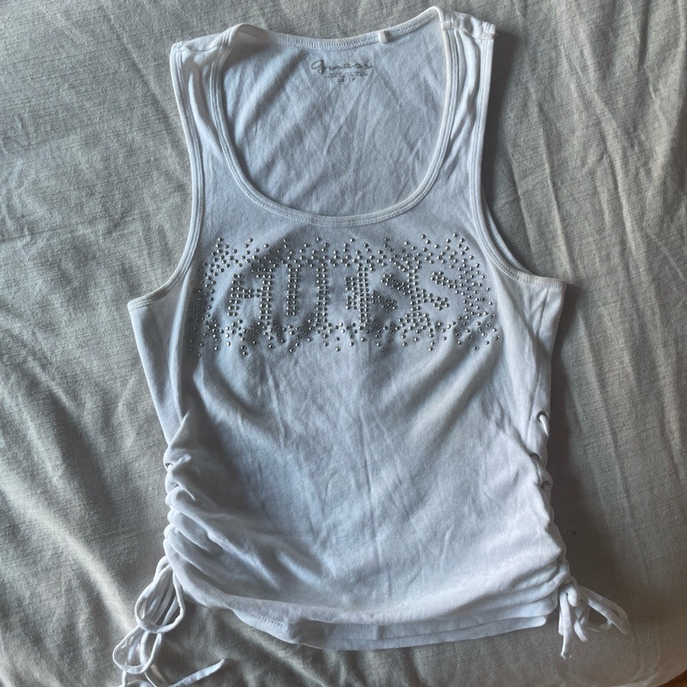 White bedazzled guest top with braided ties on each hip